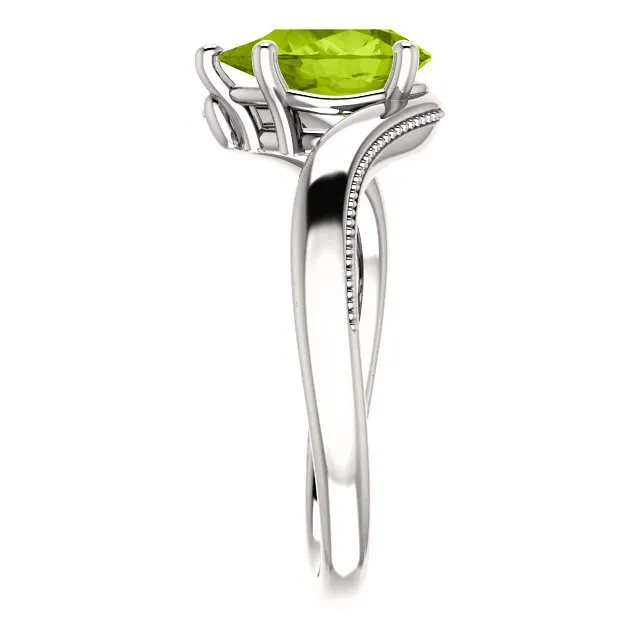 14KT GOLD 1.50 CTW PEAR SHAPE PERIDOT RING