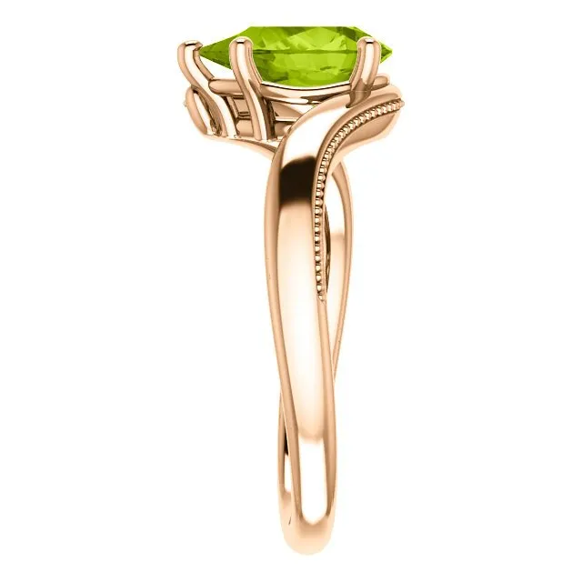 14KT GOLD 1.50 CTW PEAR SHAPE PERIDOT RING