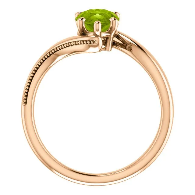 14KT GOLD 1.50 CTW PEAR SHAPE PERIDOT RING