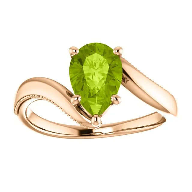 14KT GOLD 1.50 CTW PEAR SHAPE PERIDOT RING