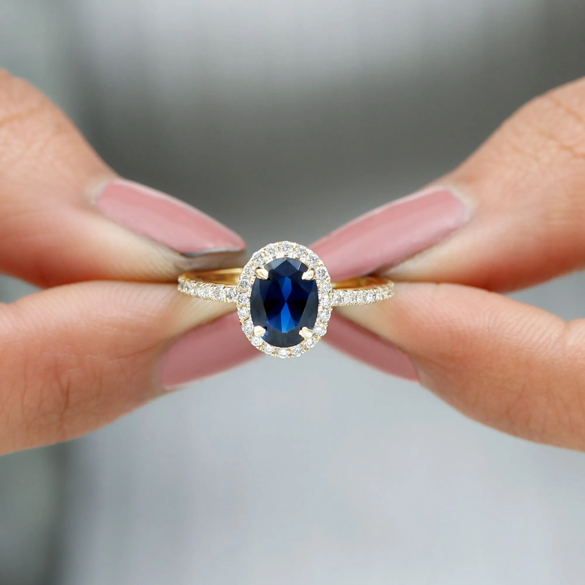 2 CT Oval Cut Lab Created Blue Sapphire Ring with Diamond Halo and Side Stones