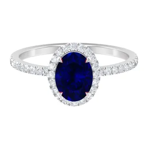 2 CT Oval Cut Lab Created Blue Sapphire Ring with Diamond Halo and Side Stones