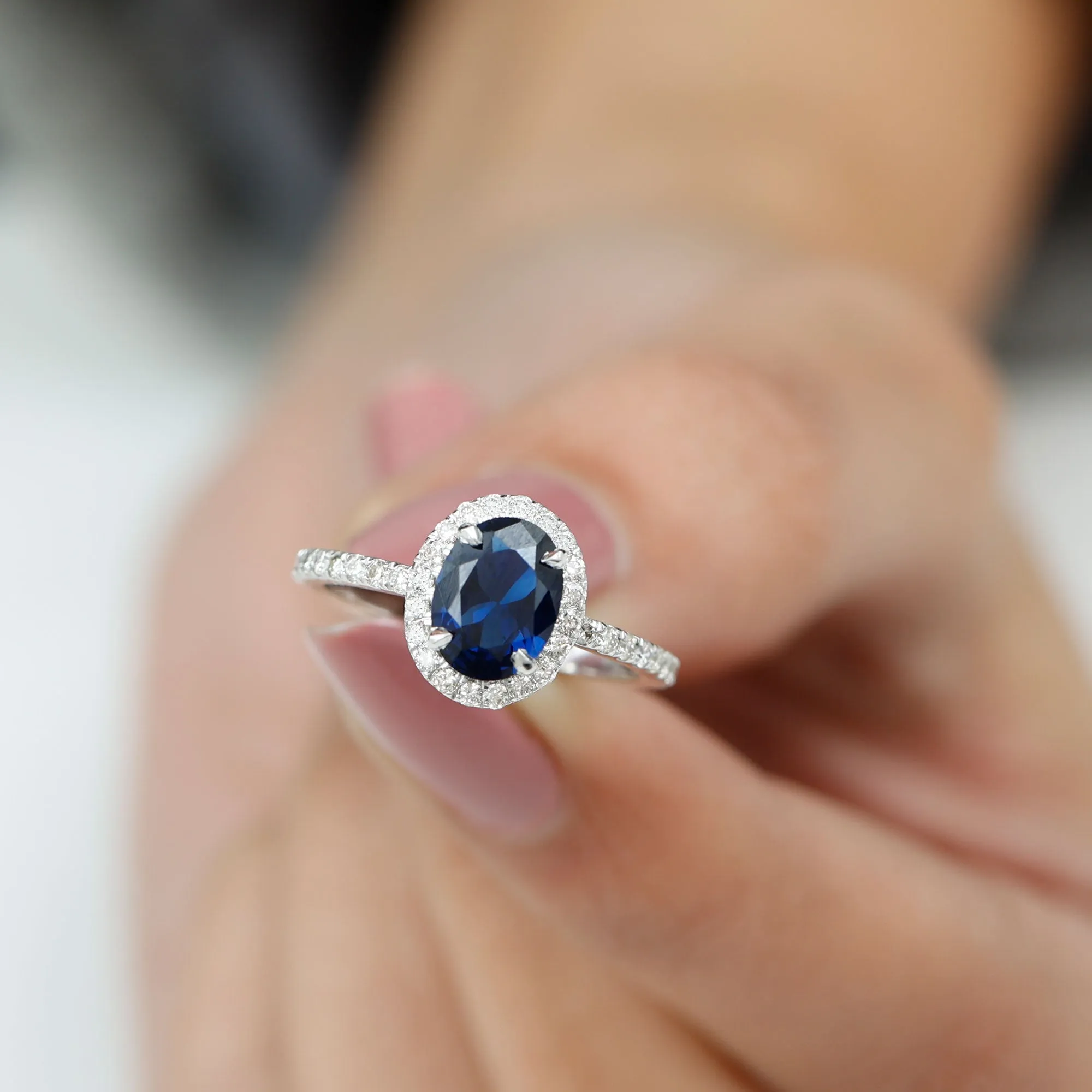 2 CT Oval Cut Lab Created Blue Sapphire Ring with Diamond Halo and Side Stones