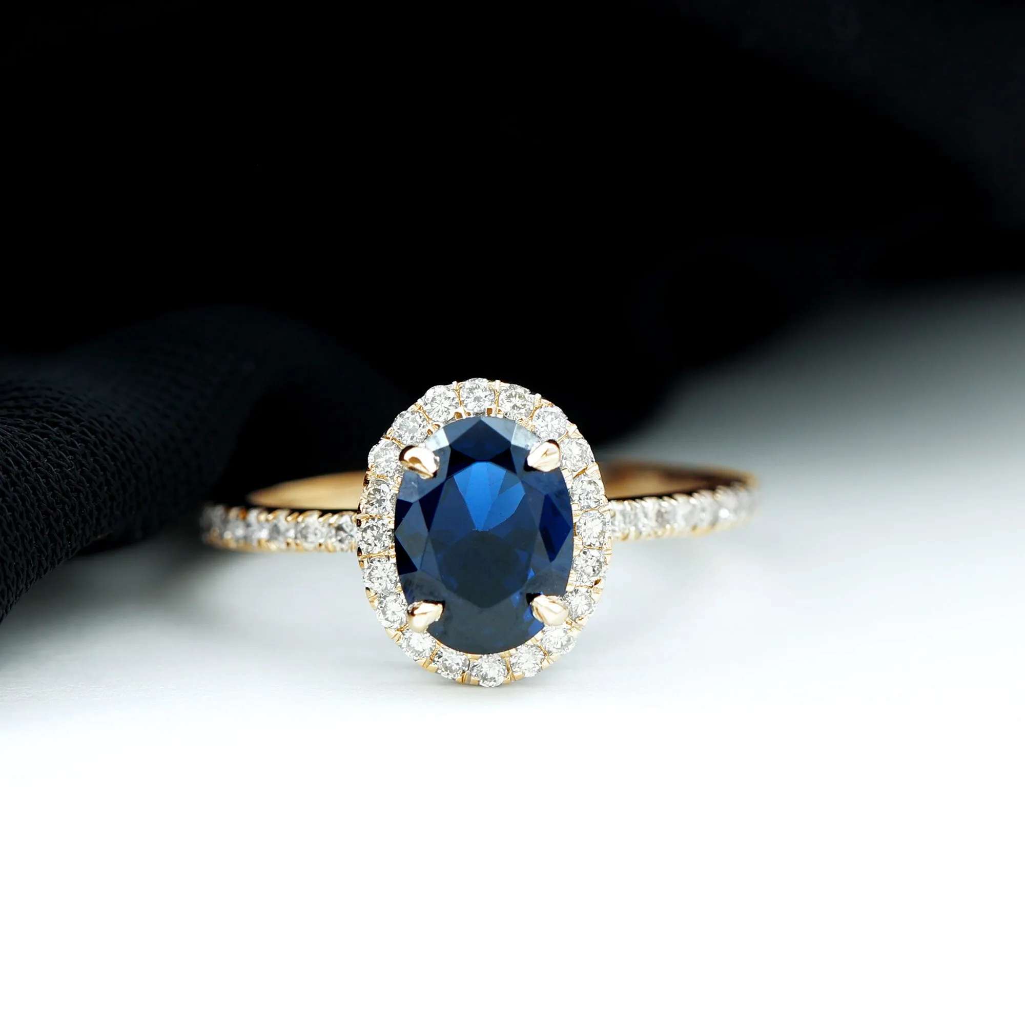 2 CT Oval Cut Lab Created Blue Sapphire Ring with Diamond Halo and Side Stones