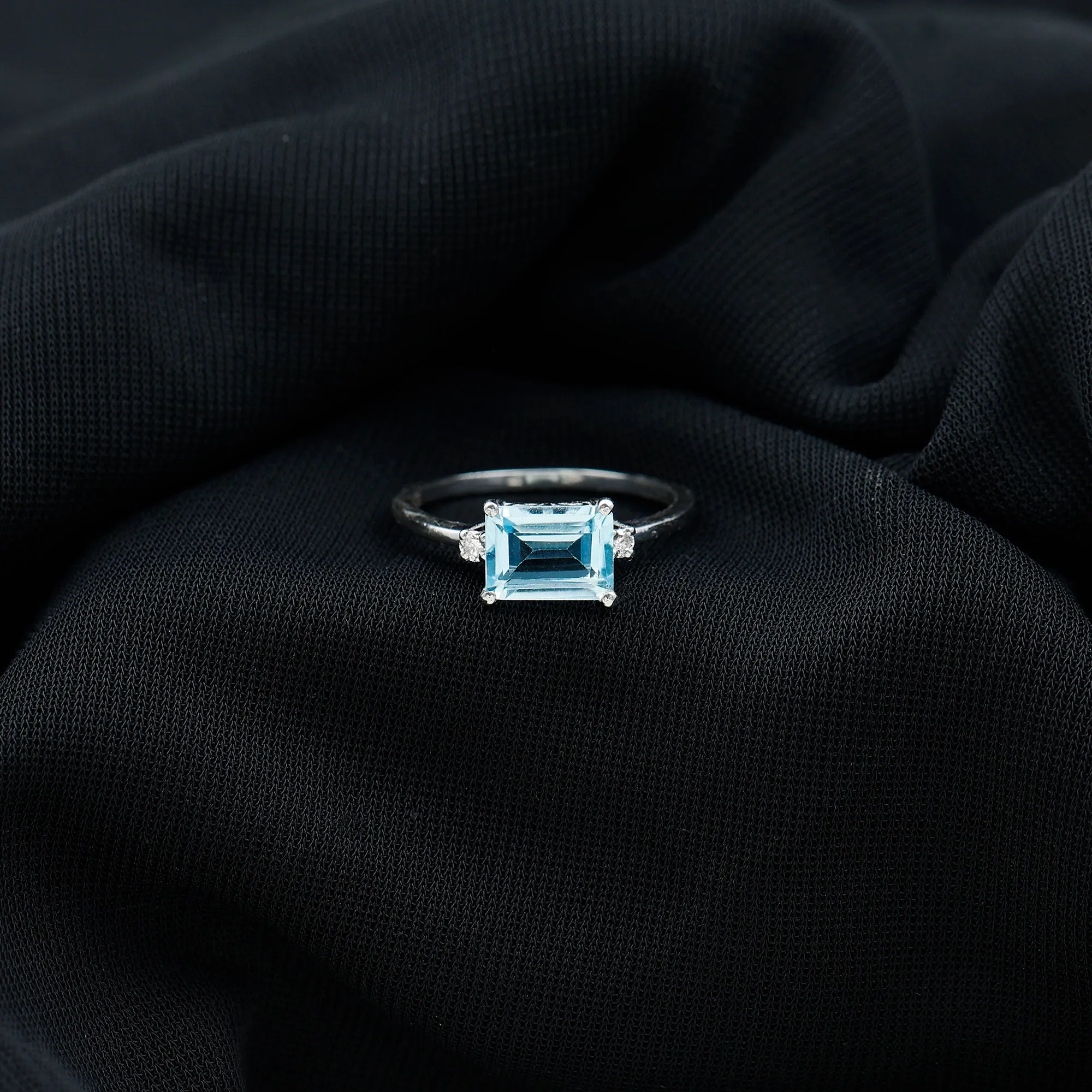 Emerald Cut Sky Blue Topaz East West Engagement Ring with Diamond