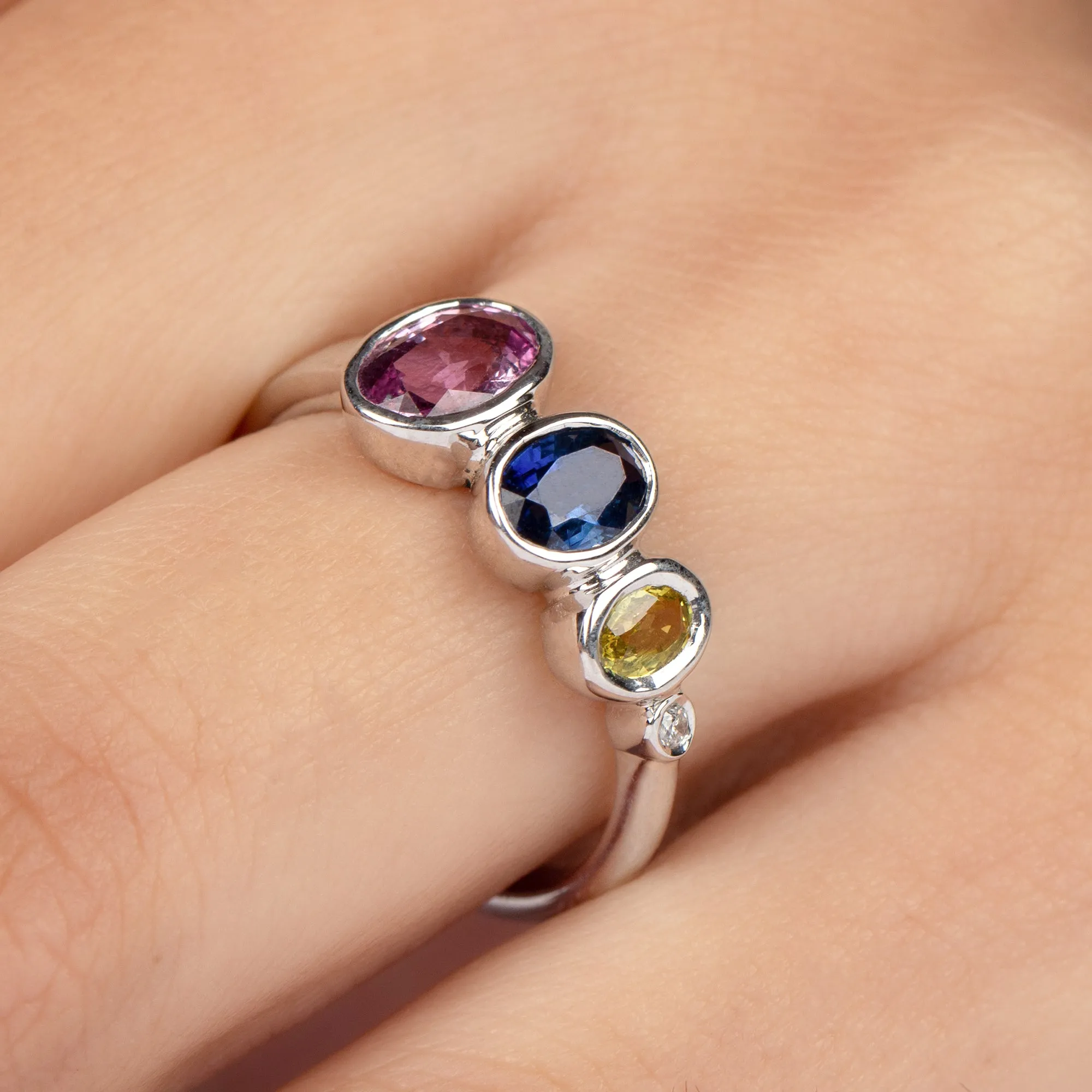 Graduated Style Oval Cut Multi Created Sapphire Ring with Moissanite