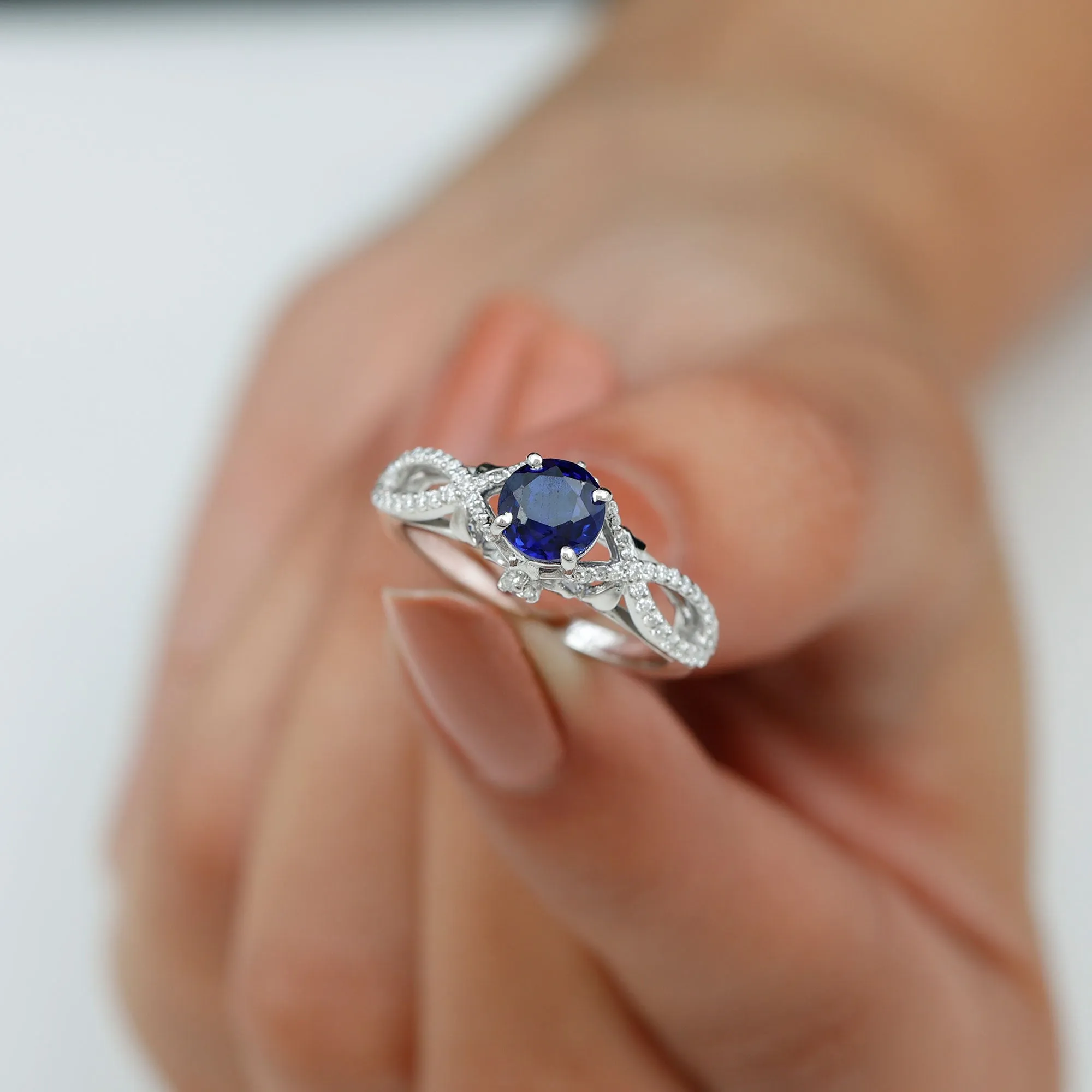 Lab Grown Blue Sapphire Crossover Engagement Ring with Diamond