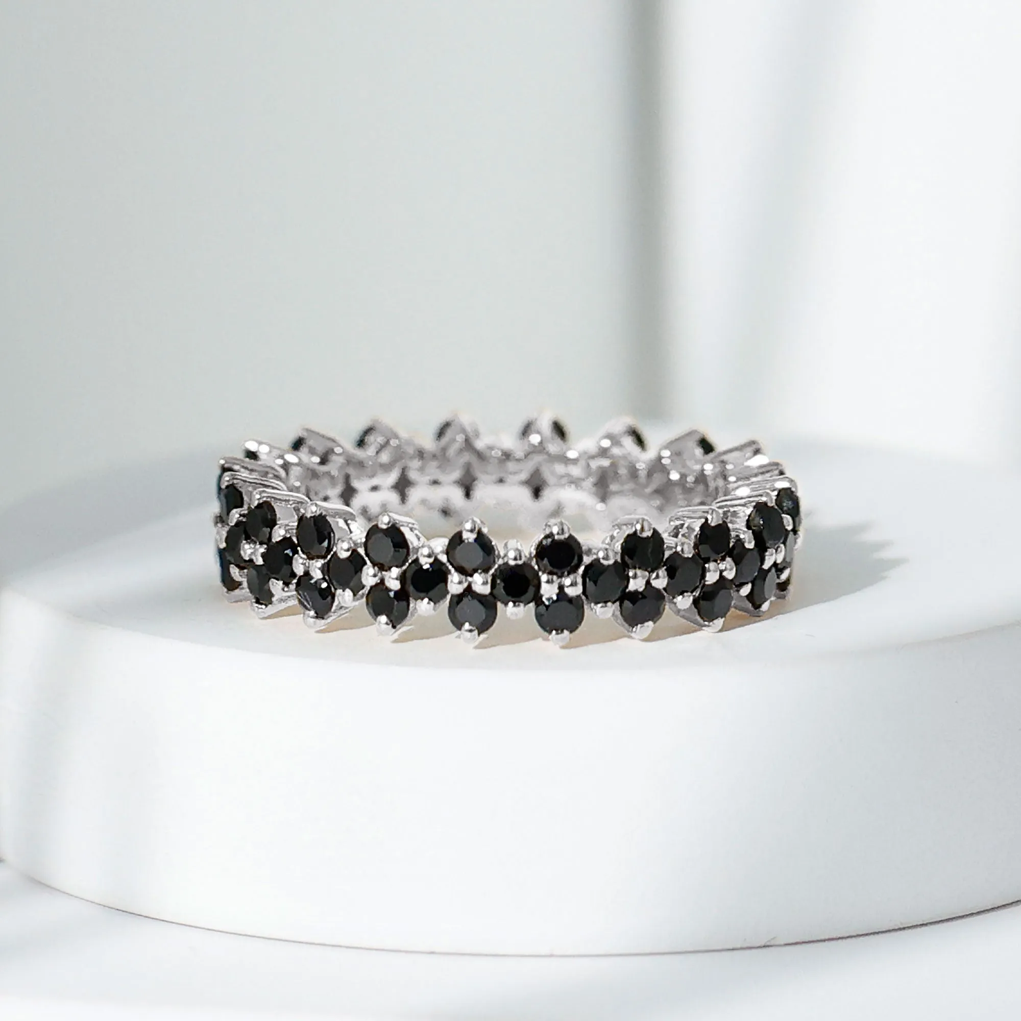 Round Black Spinel Cluster Eternity Ring in Prong Setting